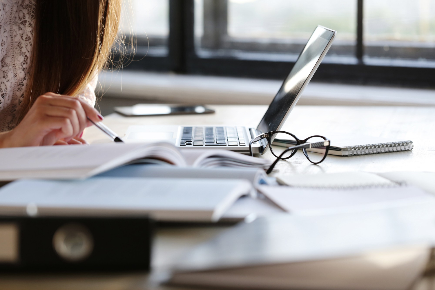 https://dialreach.com/wp-content/uploads/2023/11/woman-working-office.jpg